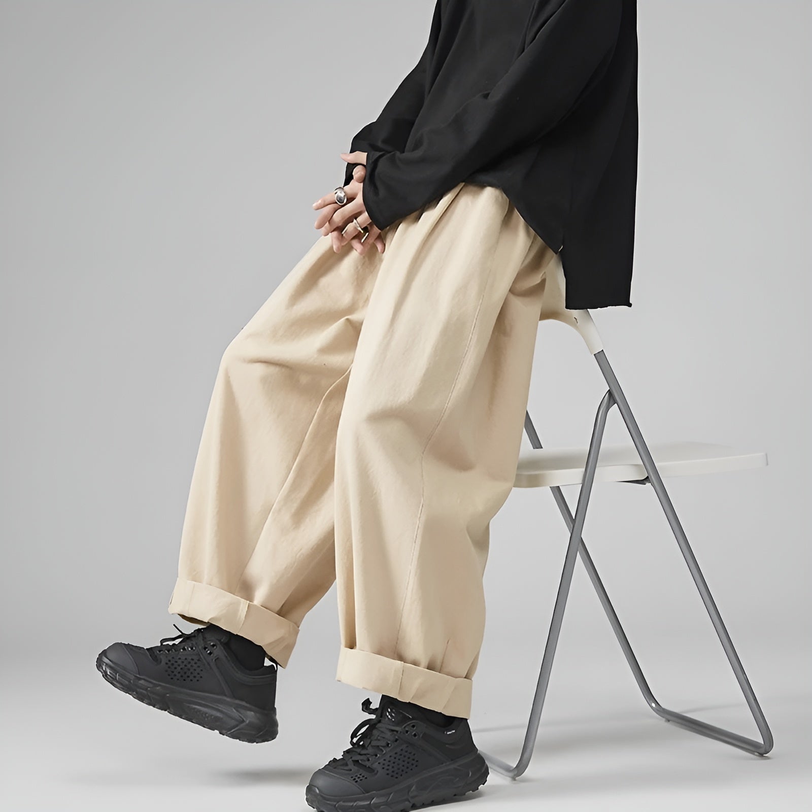 Beige oversized pleated cargo sarouel chinos pants with relaxed urban silhouette and cotton comfort