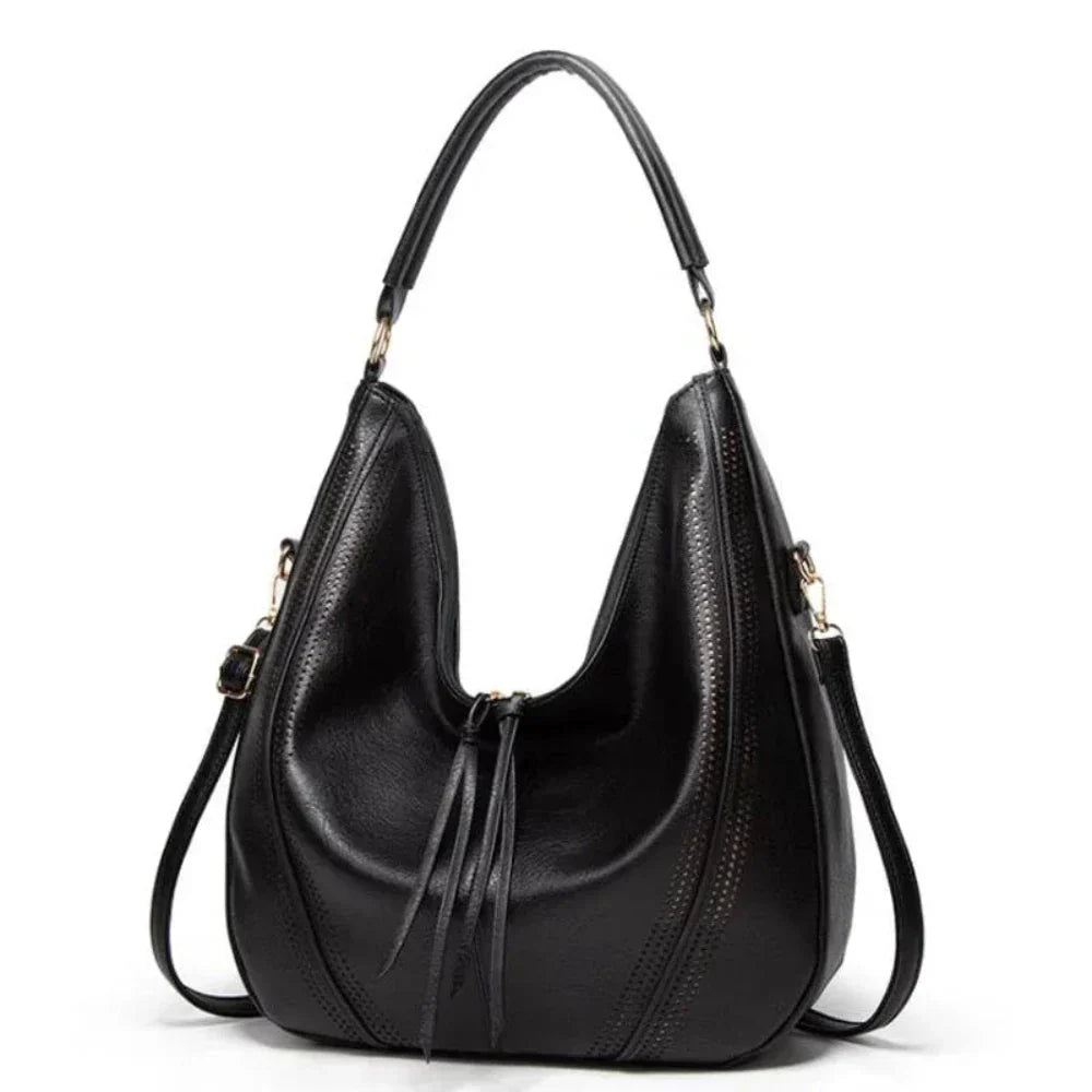 Black vegan leather slouchy hobo bag adjustable strap perforated detailing everyday women