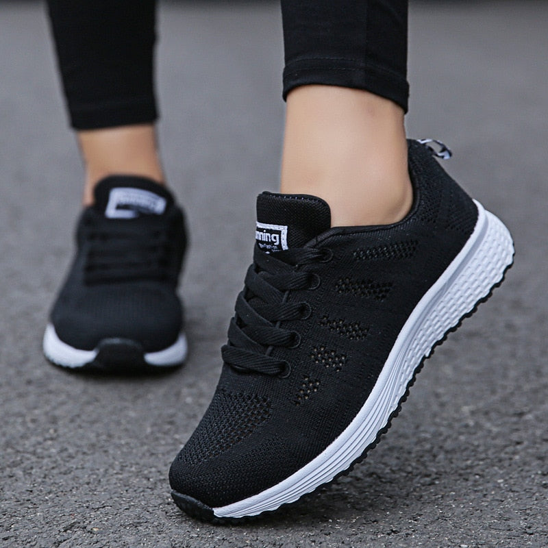 Women's orthopedic walking shoes with breathable knit mesh upper and built-in arch support for posture relief