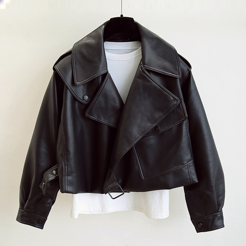 Women's cropped belted jacket with wide lapel, defined waist, modern structured silhouette