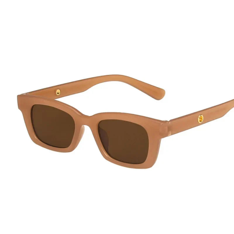 Bold black rectangular wayfarer sunglasses with dark lenses and gold-tone temple accents for sunny occasions