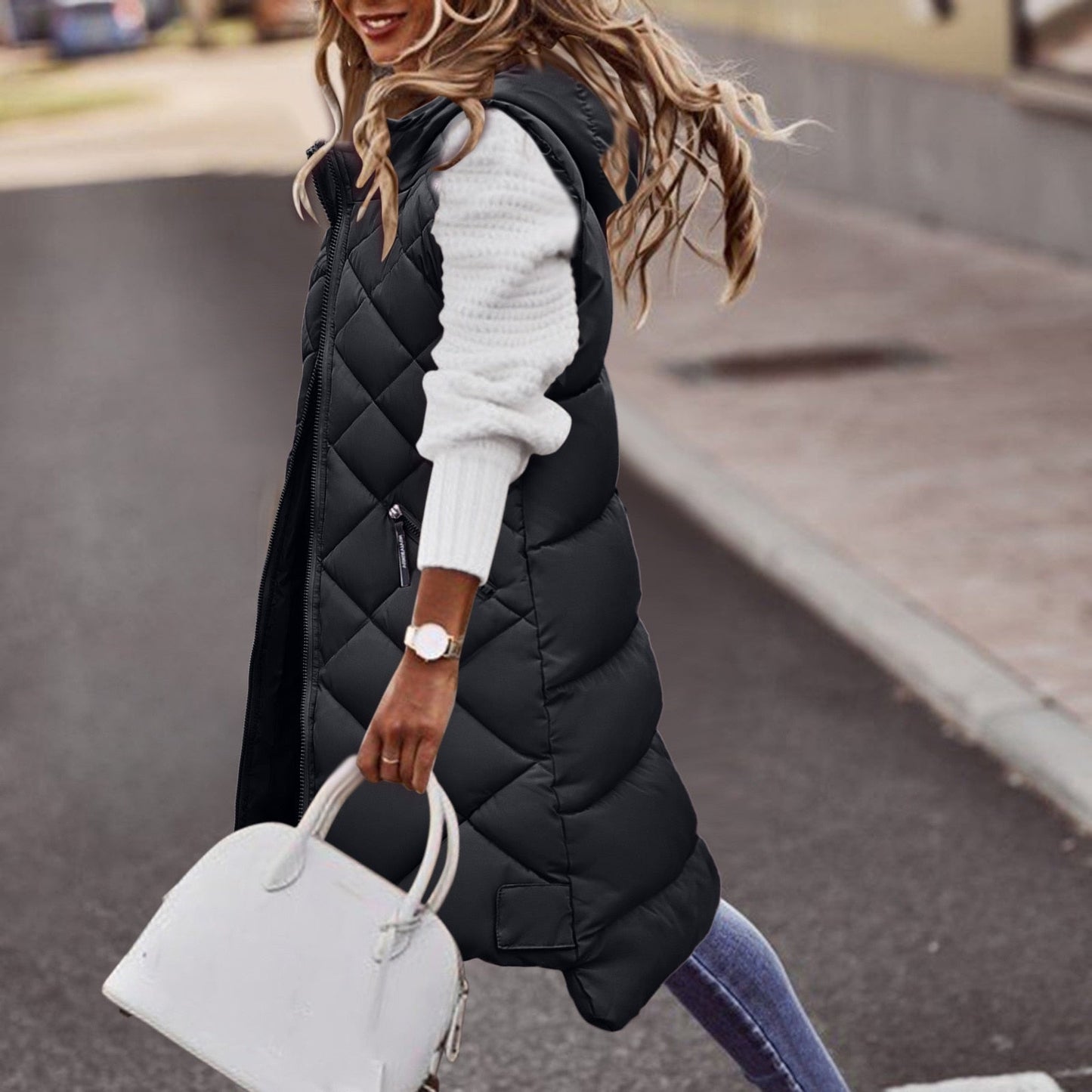 Women's quilted longline hooded vest with zipper pockets, relaxed fit insulated layer for fall