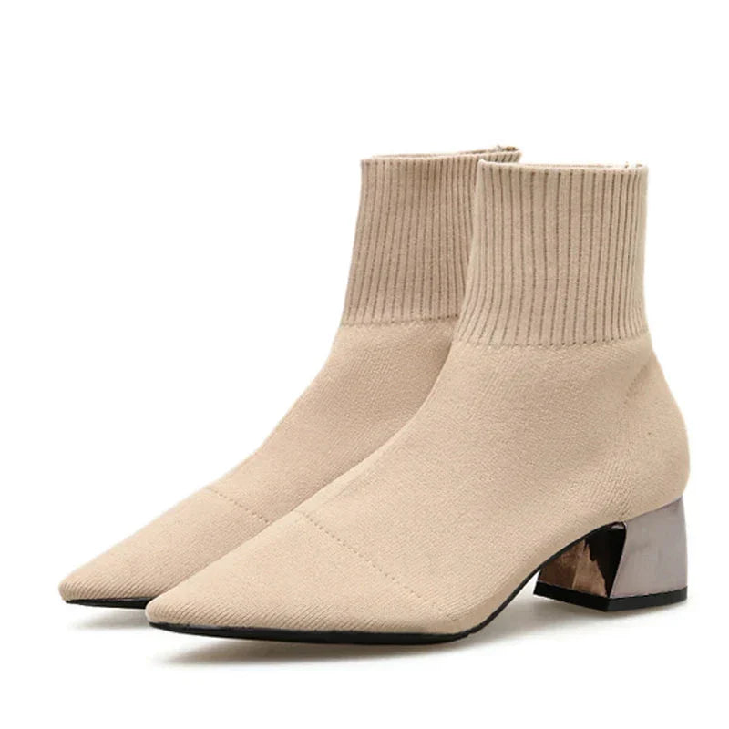 Women's knitted ankle boot slip-on style with sock-like elastic upper and chrome block heel