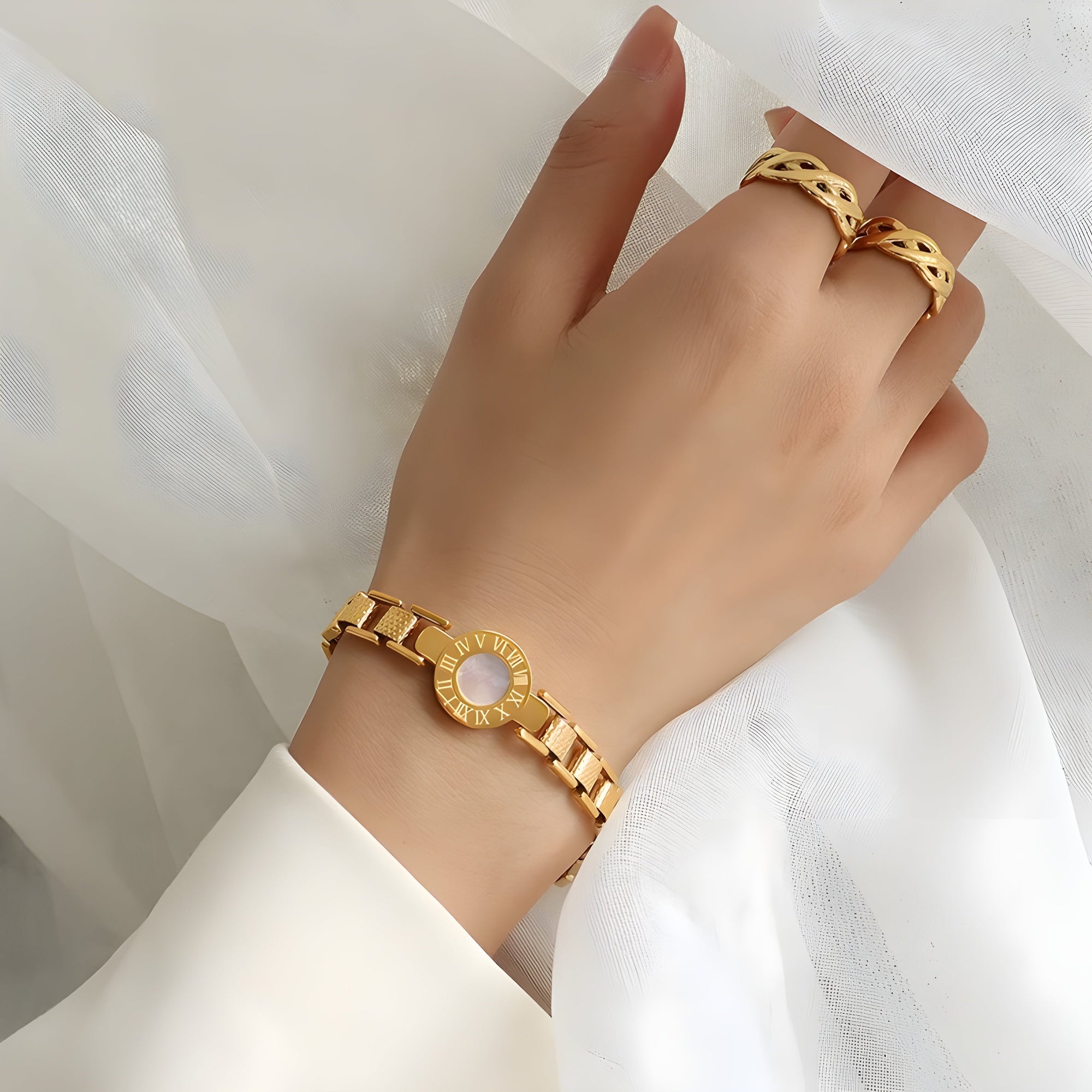Roma Halo pearl face bracelet titanium plated chain Roman numeral accents gold-toned geometric cubes
