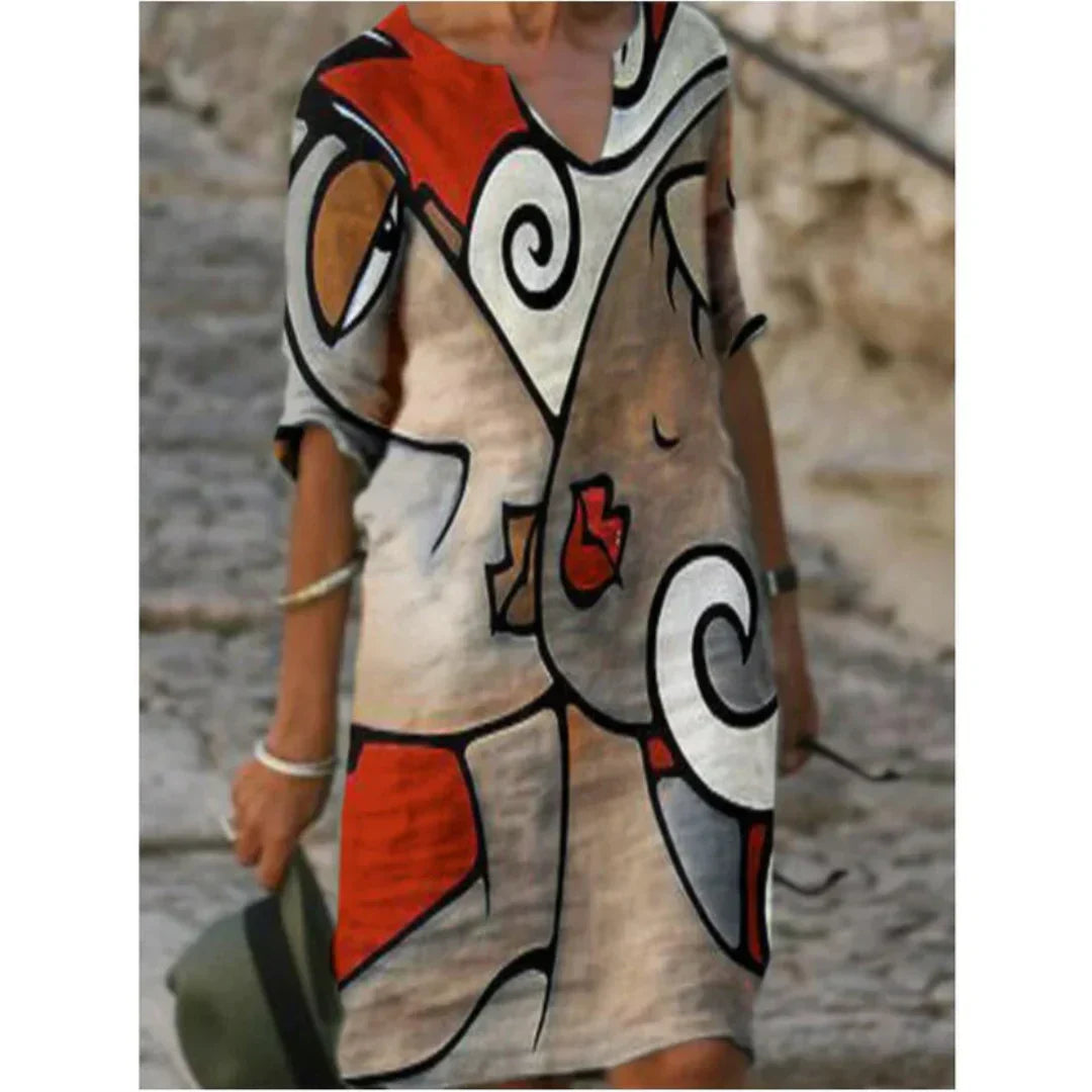Women's floral midi dress with artistic face print, V-neckline, and delicate floral accents for everyday wear