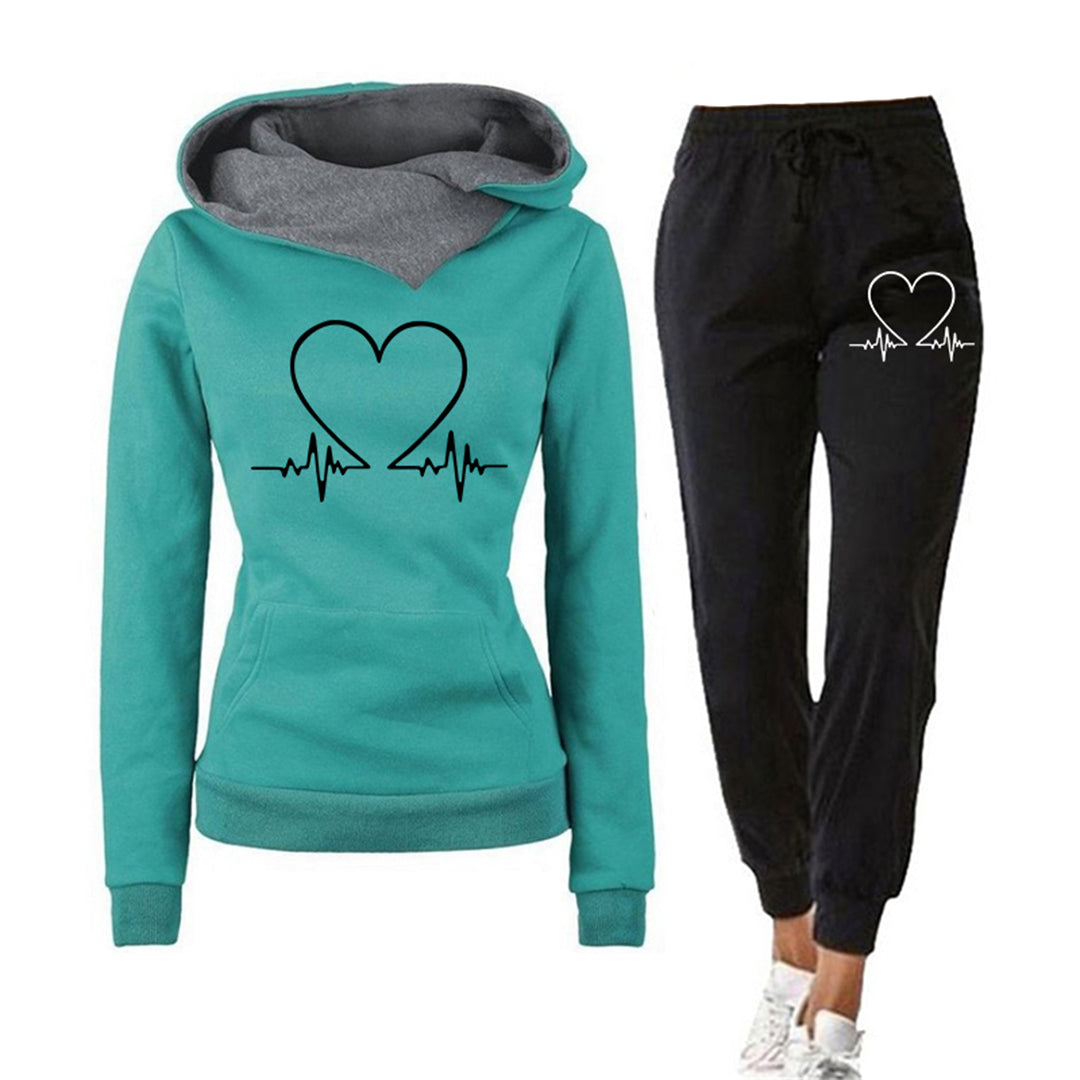 Women's relaxed fit two-piece tracksuit hoodie and joggers set with minimal heart graphic, cozy lounge style