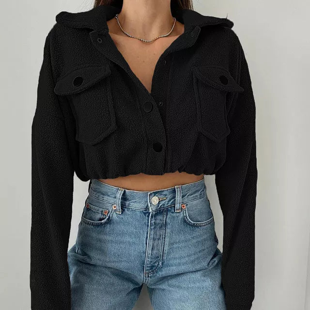 Women's cropped bomber jacket with button front, oversized flap pockets, casual street style silhouette