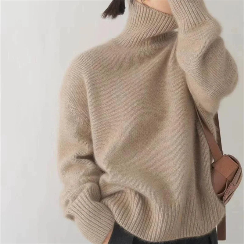 Women's oversized cashmere turtleneck sweater in soft neutral tone, relaxed fit, 100% pure cashmere