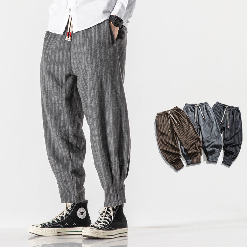 Men's white pinstripe tapered joggers with drawstring waist, lightweight breathable streetwear fit