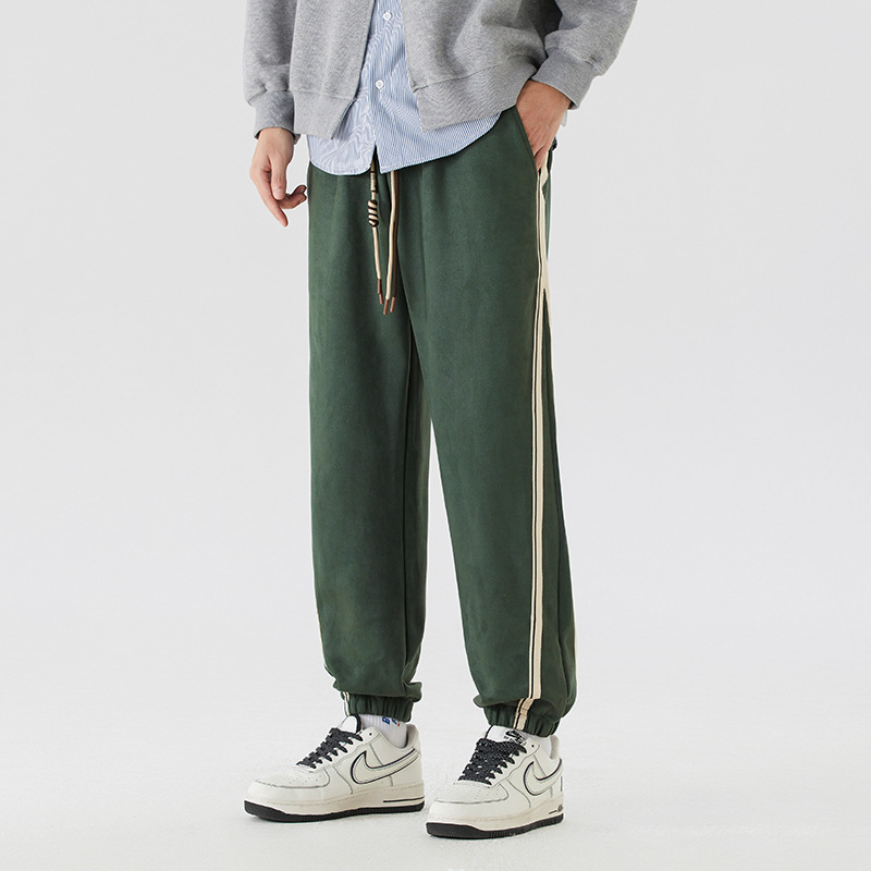 Vintage washed cotton joggers with bold contrast side stripes, retro streetwear cut for men