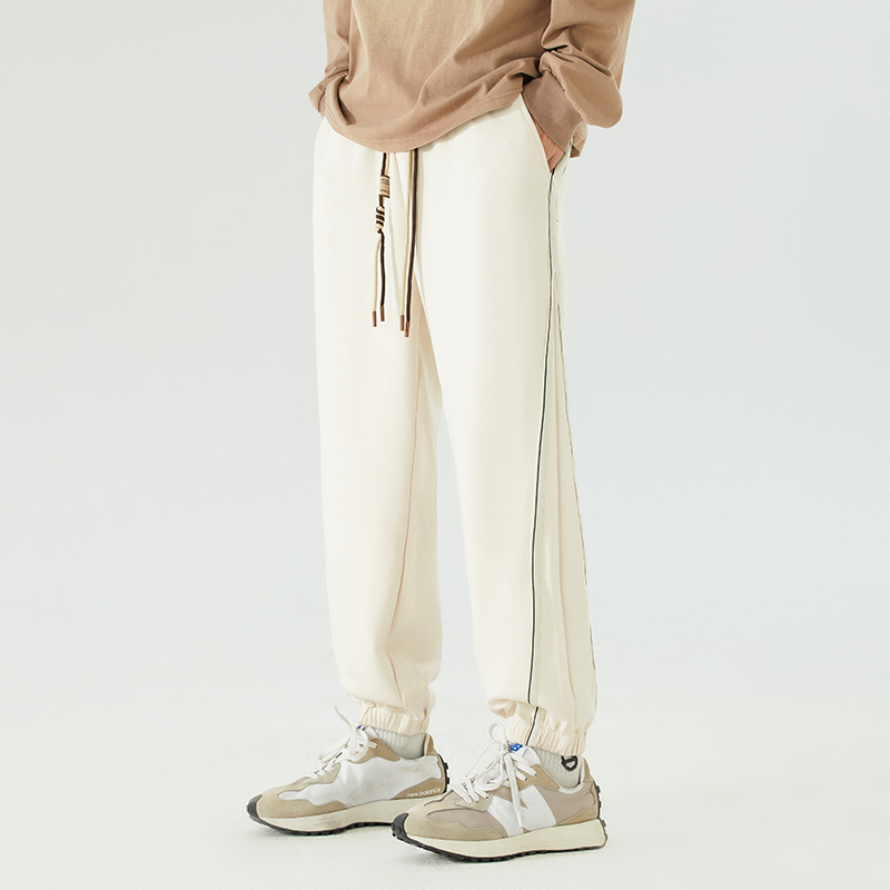 Washed cotton vintage joggers with bold contrast side stripes, retro streetwear cut for effortless style