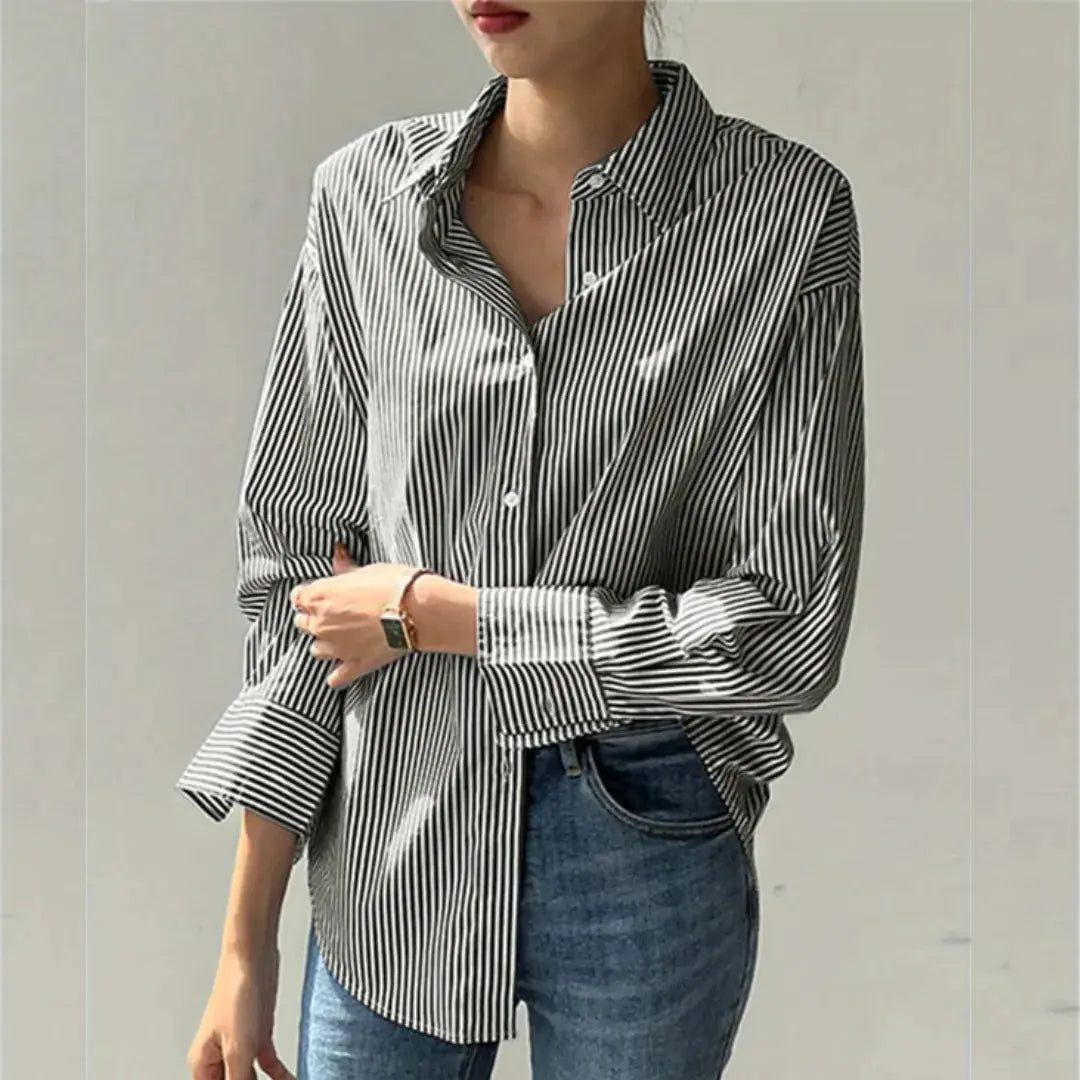 Women's white pinstripe oversized long-sleeve button-up shirt with relaxed fit for layering