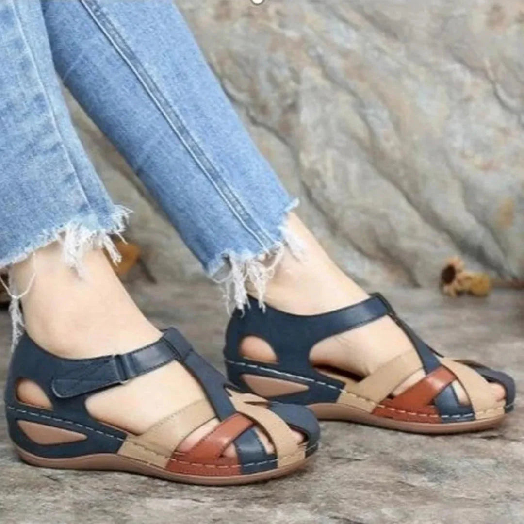Women's brown closed-toe leather sandals with breathable cut-outs and secure velcro strap