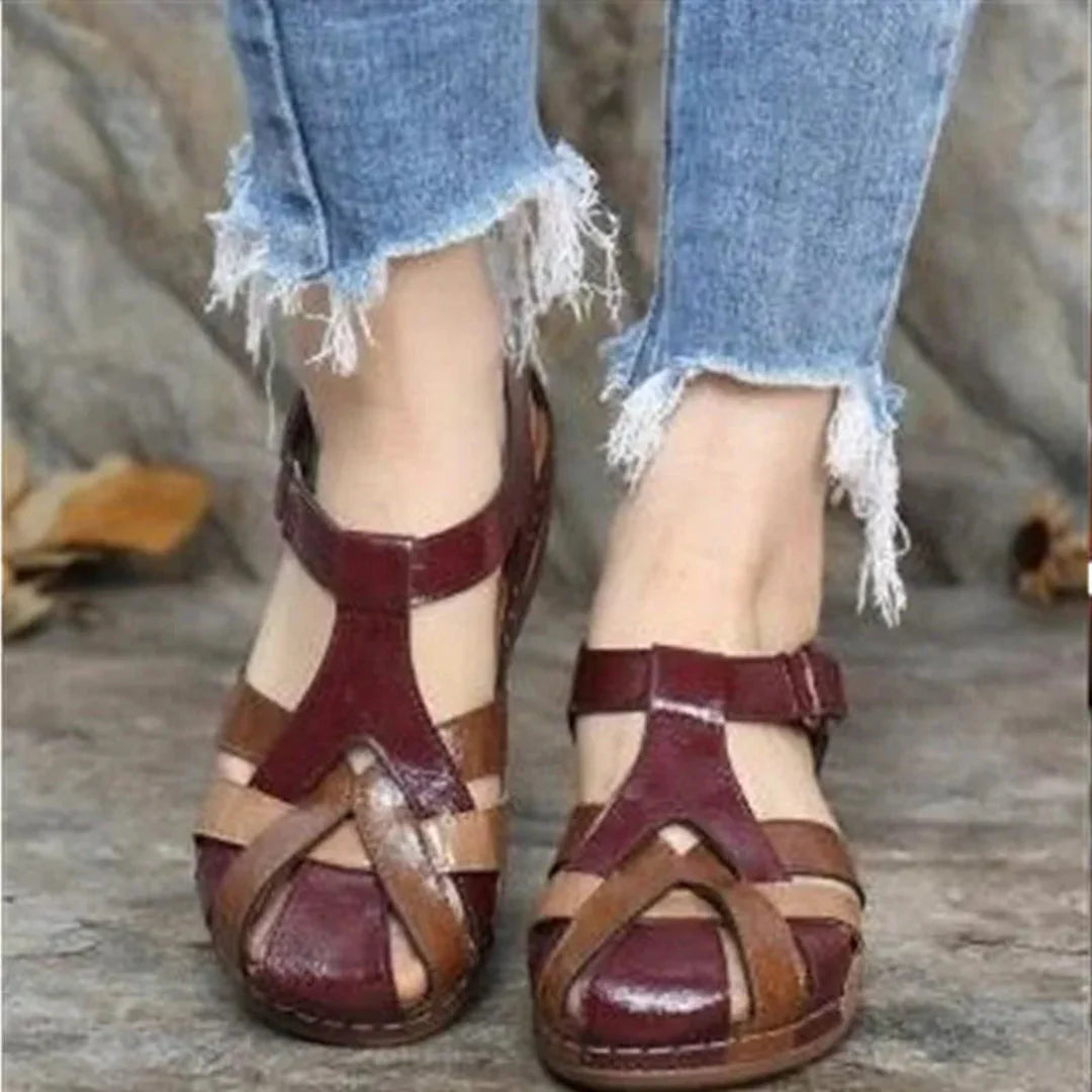 Women's brown closed-toe leather sandals with breathable cut-out design and secure velcro strap