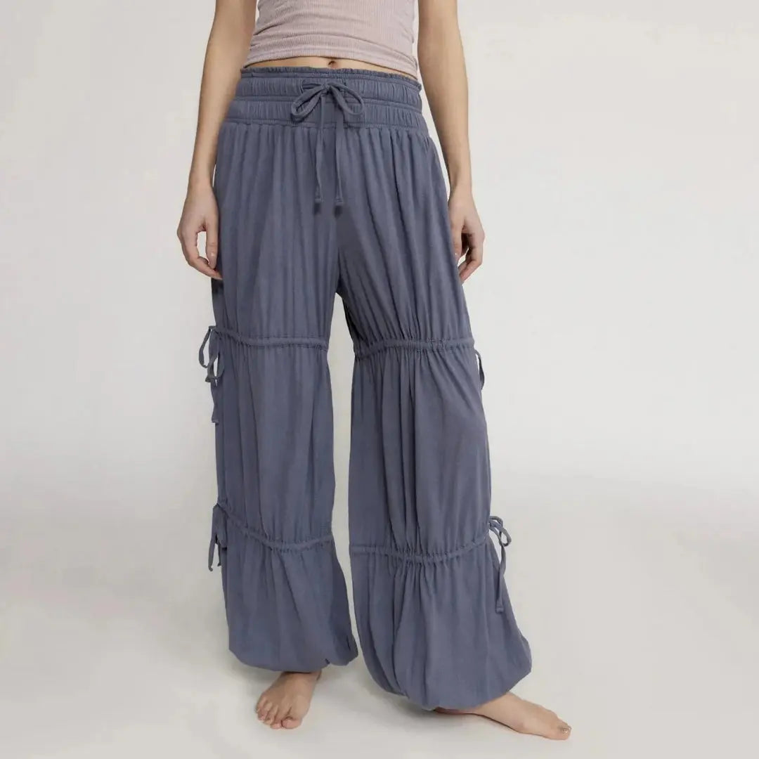 Boho tiered wide-leg lounge pants with drawstring waist, flowing gathered panels, relaxed fit