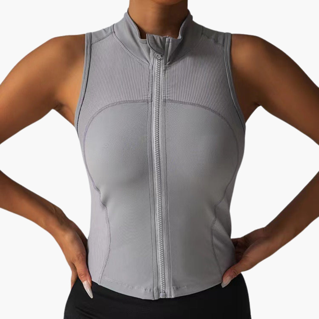 Women's fitted sleeveless sports top, zip front high collar, ribbed chest detail, gym performance shirt