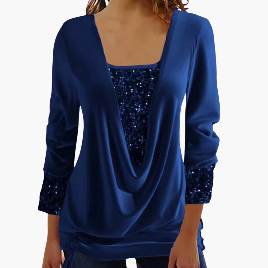 Women's black draped top with sequin collar yoke, cuffed panels, and side tie hem