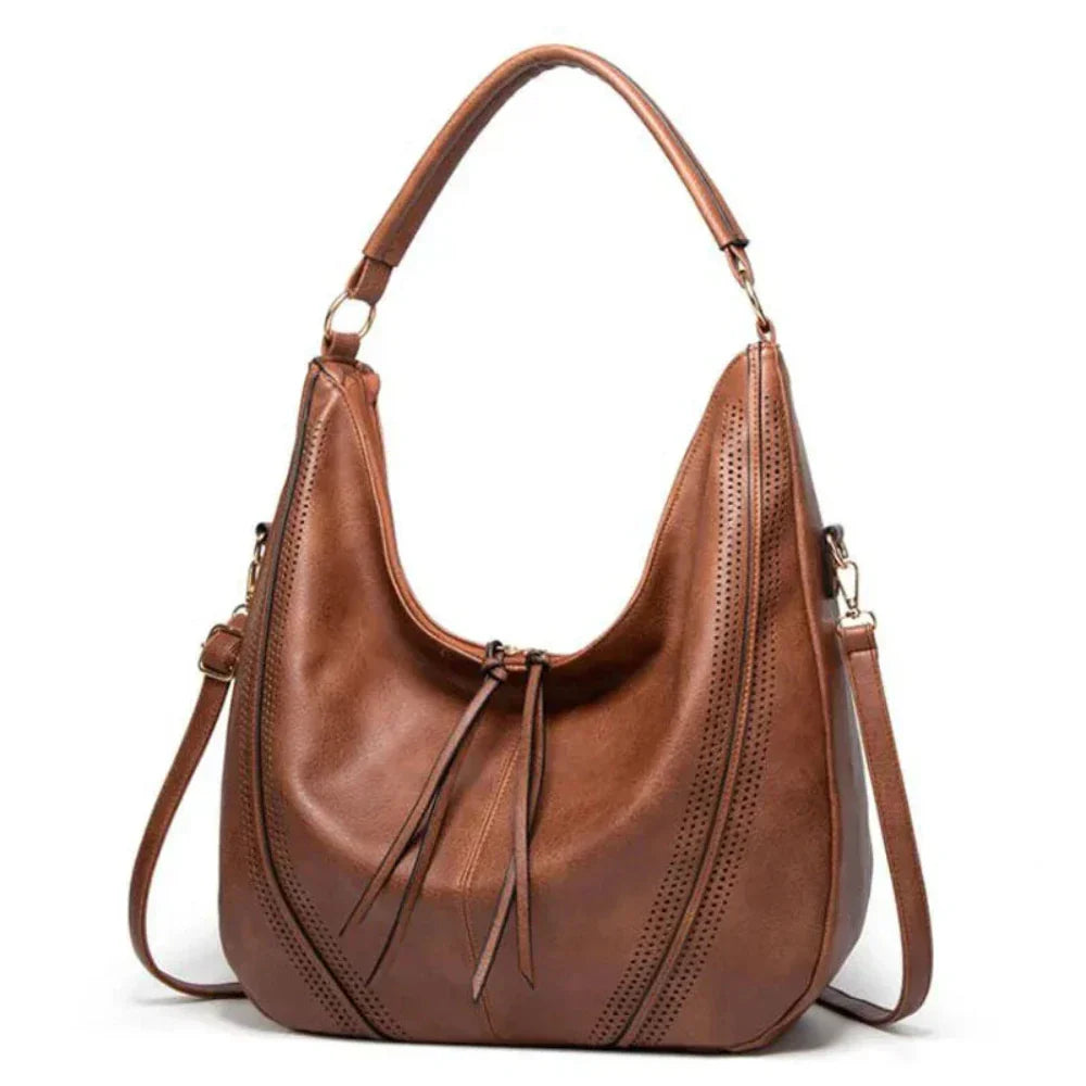 Black vegan leather slouchy hobo bag adjustable strap perforated detailing everyday women