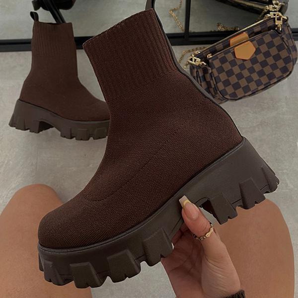 Women's slip-on chunky heel boots with stretch upper and lug sole for bold casual city style