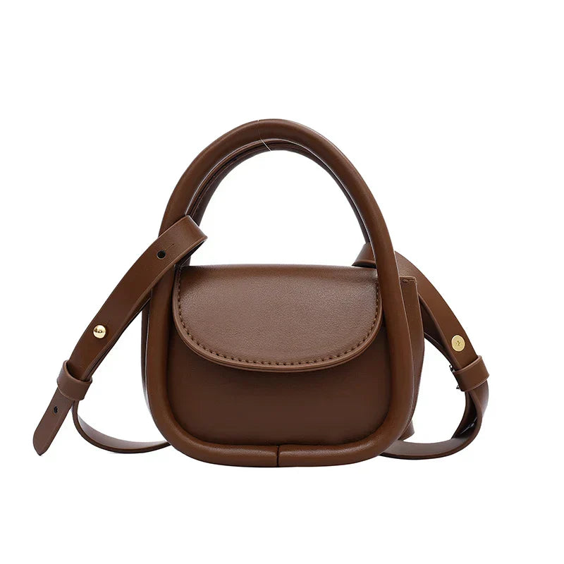 Genuine leather mini crossbody bag with adjustable strap and snap-flap closure for city style