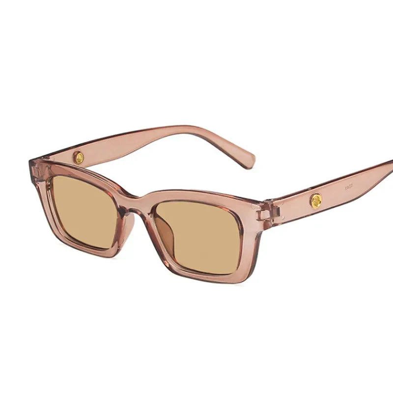 Bold black rectangular wayfarer sunglasses with dark lenses and gold-tone temple accents