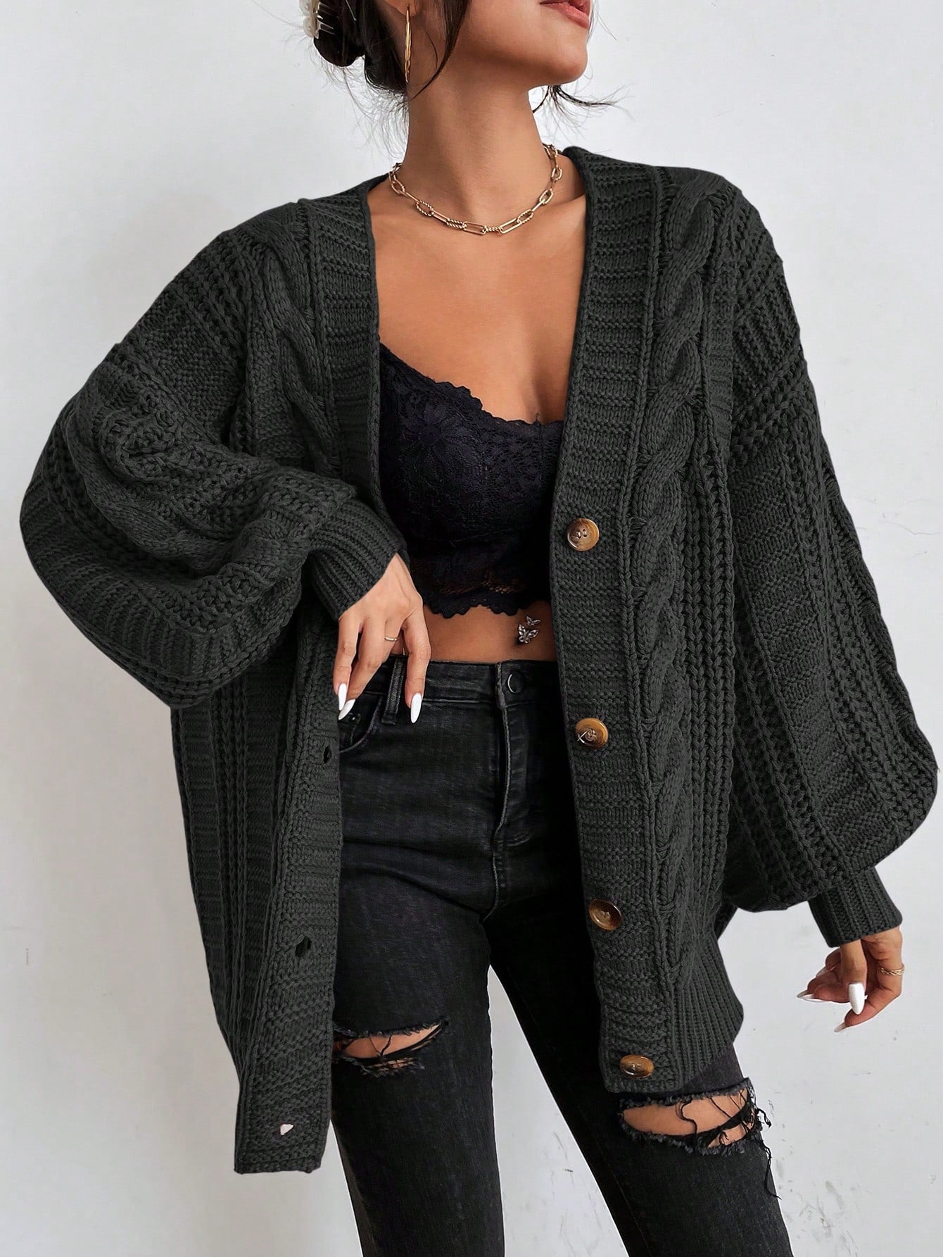Women's oversized cable knit cardigan in cozy chunky knit with dropped shoulders and relaxed fit