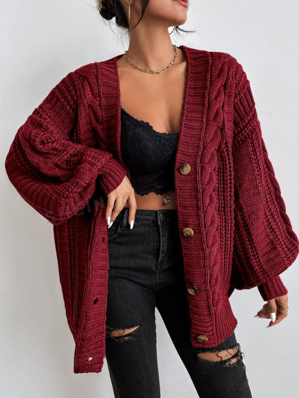Women's oversized beige cable knit cardigan with dropped shoulders and chunky ribbed texture