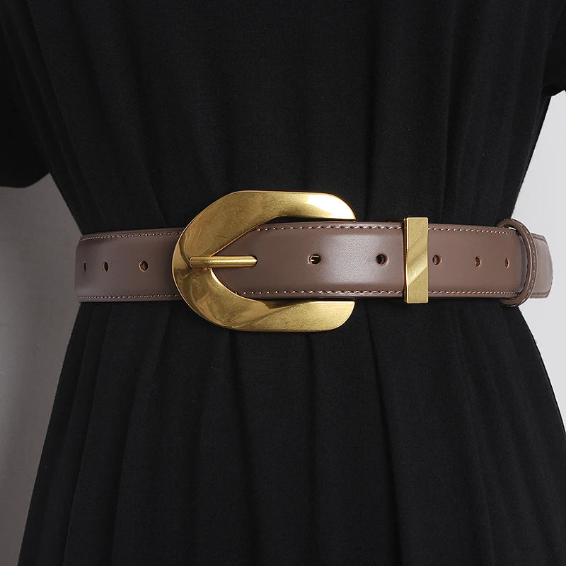 Genuine leather waistband belt with polished oversized statement buckle, adjustable one-size-fits-all runway style