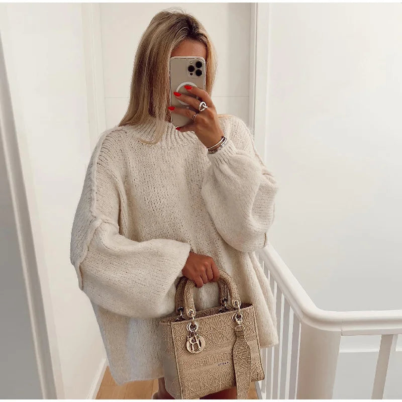 Black oversized fluffy knit sweater with voluminous sleeves, cozy relaxed fit for effortless chic layering