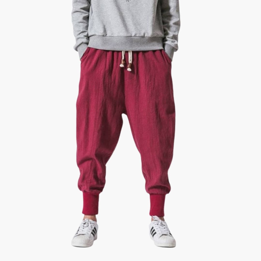 Men's harem jogger pants with drawstring, ribbed cuffs, relaxed wide cut, and side pockets