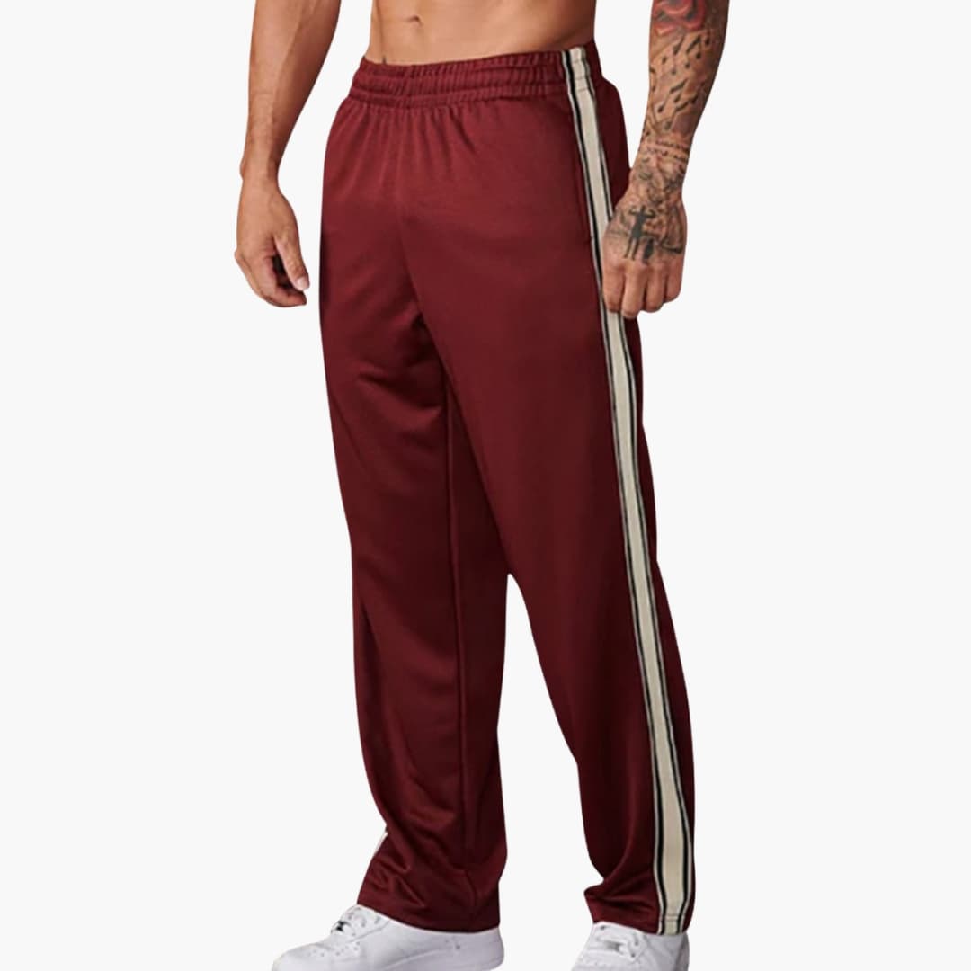 Men's black training pants straight-cut with bold side stripes and elastic waistband for athletes