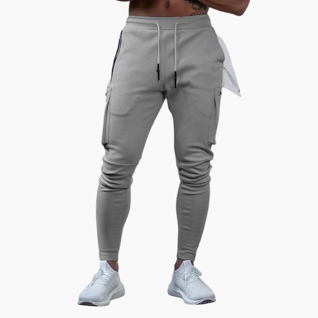 Men's tapered jogger pants with cargo pockets and ankle zippers, elastic waistband, athletic fit