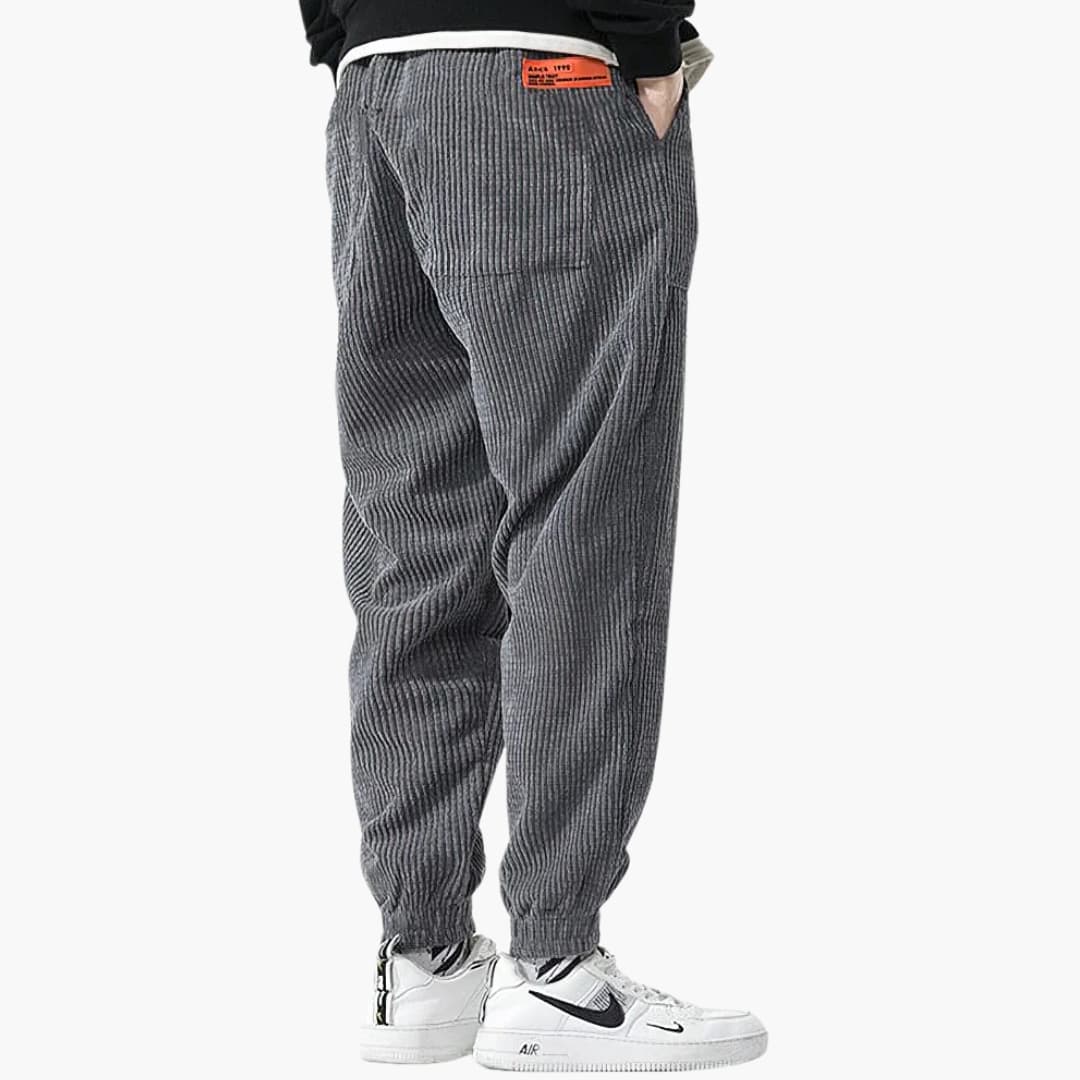 Men's brown corduroy jogger pants with drawstring elastic waist and ribbed cuffs casual fit