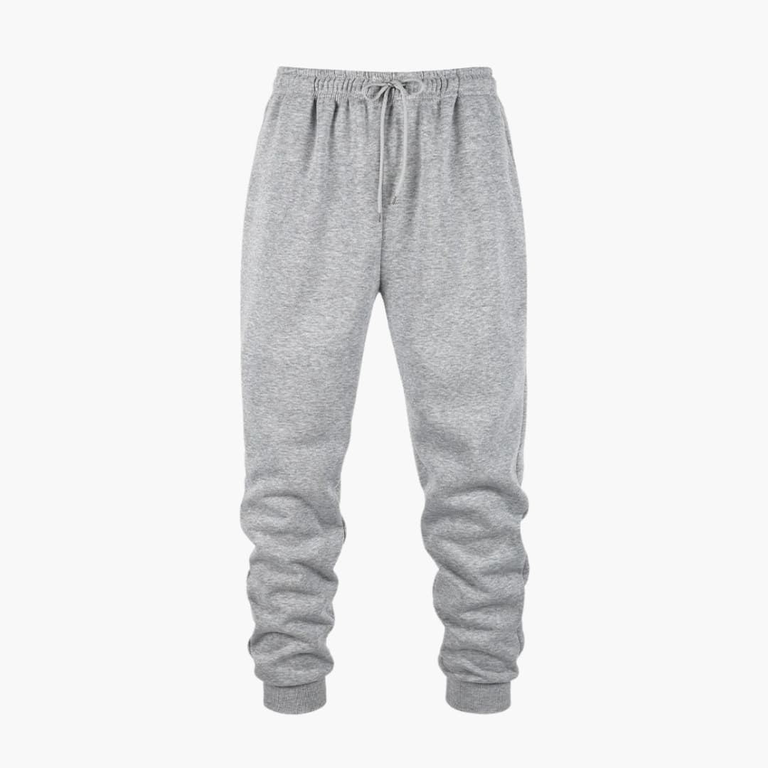 Men's tapered jogger pants with drawstring waistband, ribbed cuffs, and side pockets for active wear