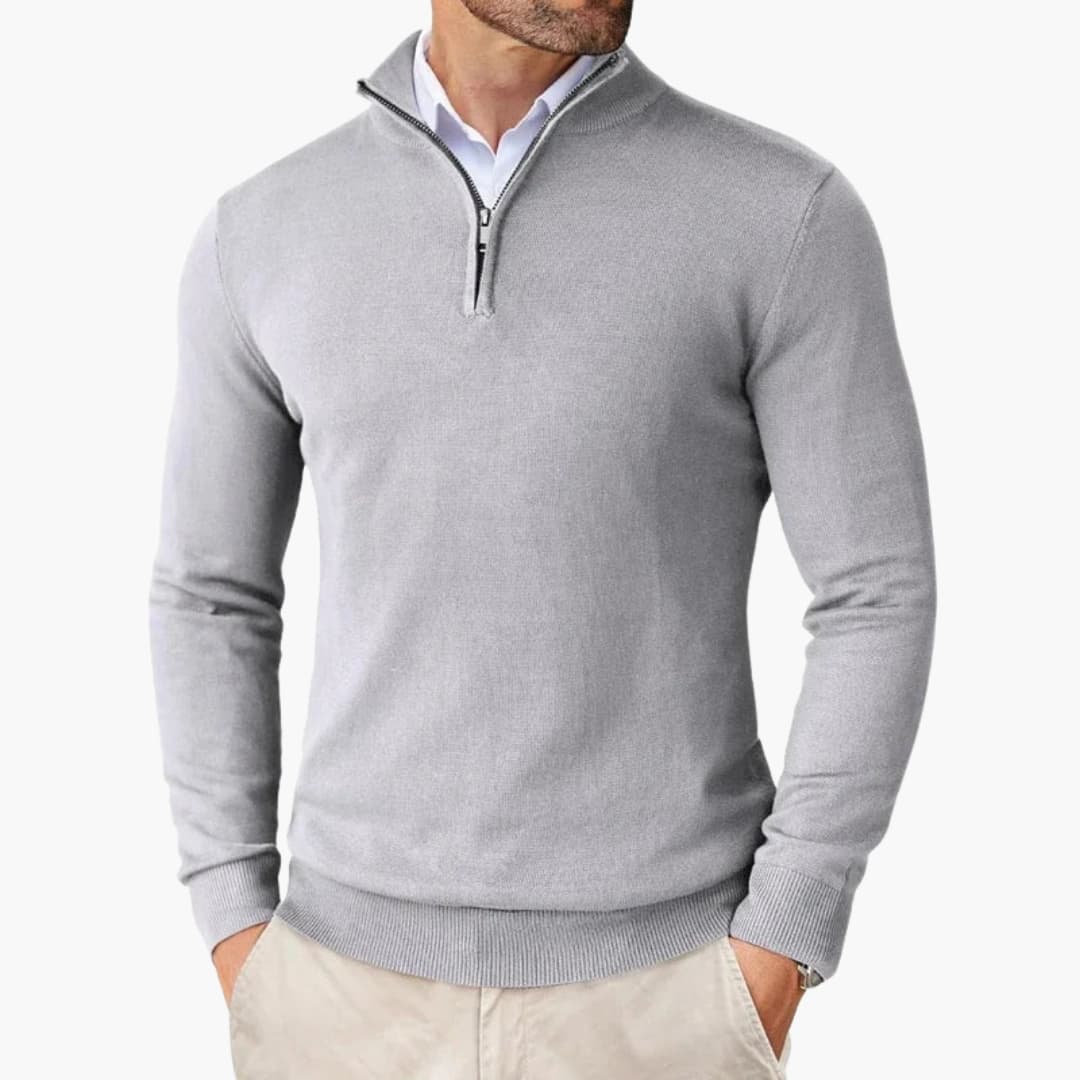 Men's gray knit half-zip sweater with stand-up collar, ribbed cuffs, and metal zipper accent