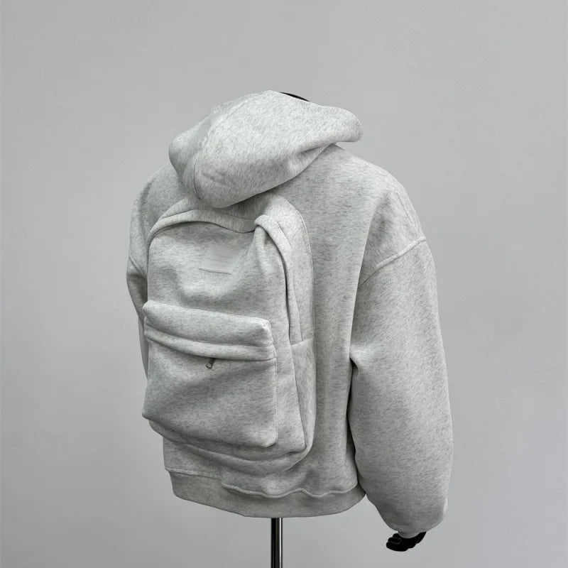 Men's gray hoodie sweatshirt with integrated backpack design, casual fit for travel and everyday wear