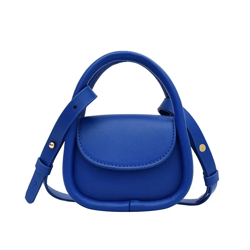 Genuine leather crossbody bag with snap closure, adjustable strap, compact city style