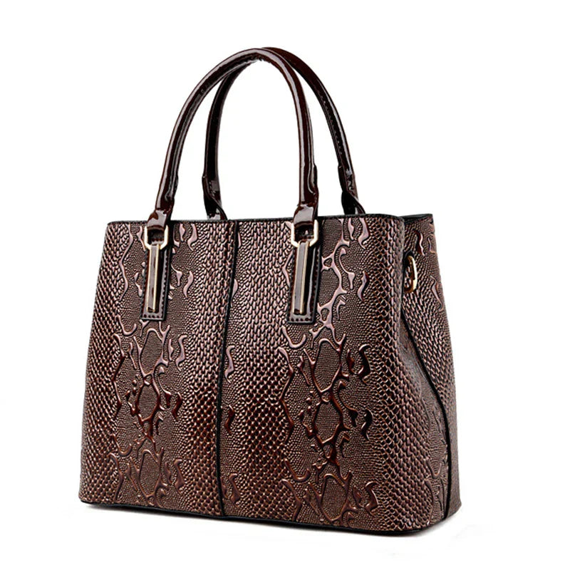 Boxy vegan patent leather tote bag with embossed crocodile snakeskin texture in splatter design
