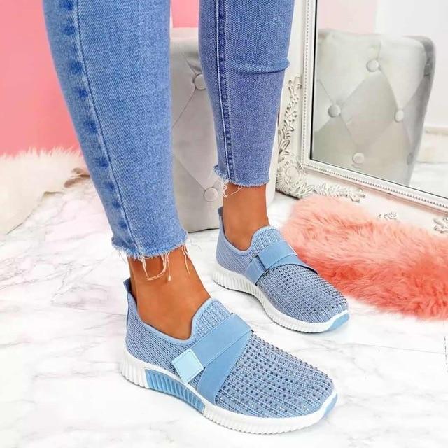 Women's white orthopedic slip-on sneakers with Velcro closure, supportive cushioned sole for all-day comfort