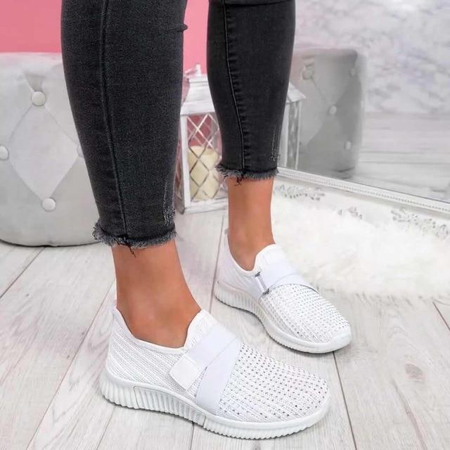 Women's white orthopedic slip-on sneakers with Velcro closure for adjustable all-day walking comfort