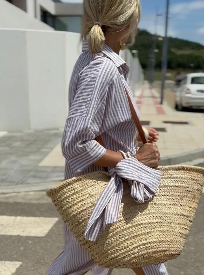 Women's striped shirt dress with high-low hem and button-front closure for effortless style