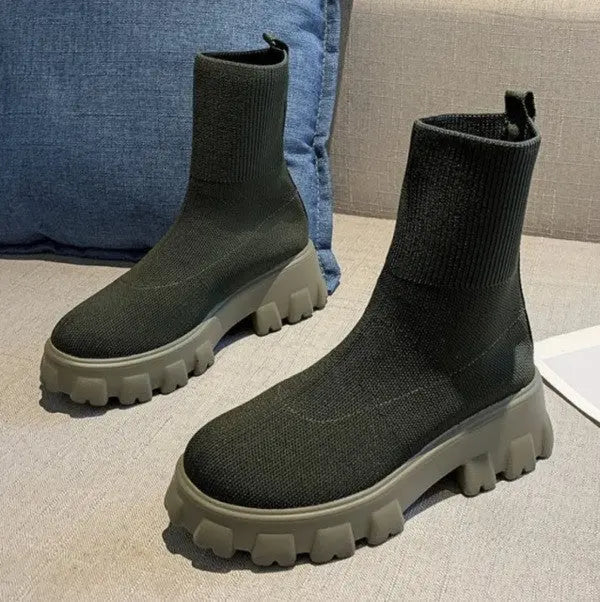 Women's black water-repellent high-top sock boots with thick platform sole and mid-calf fit