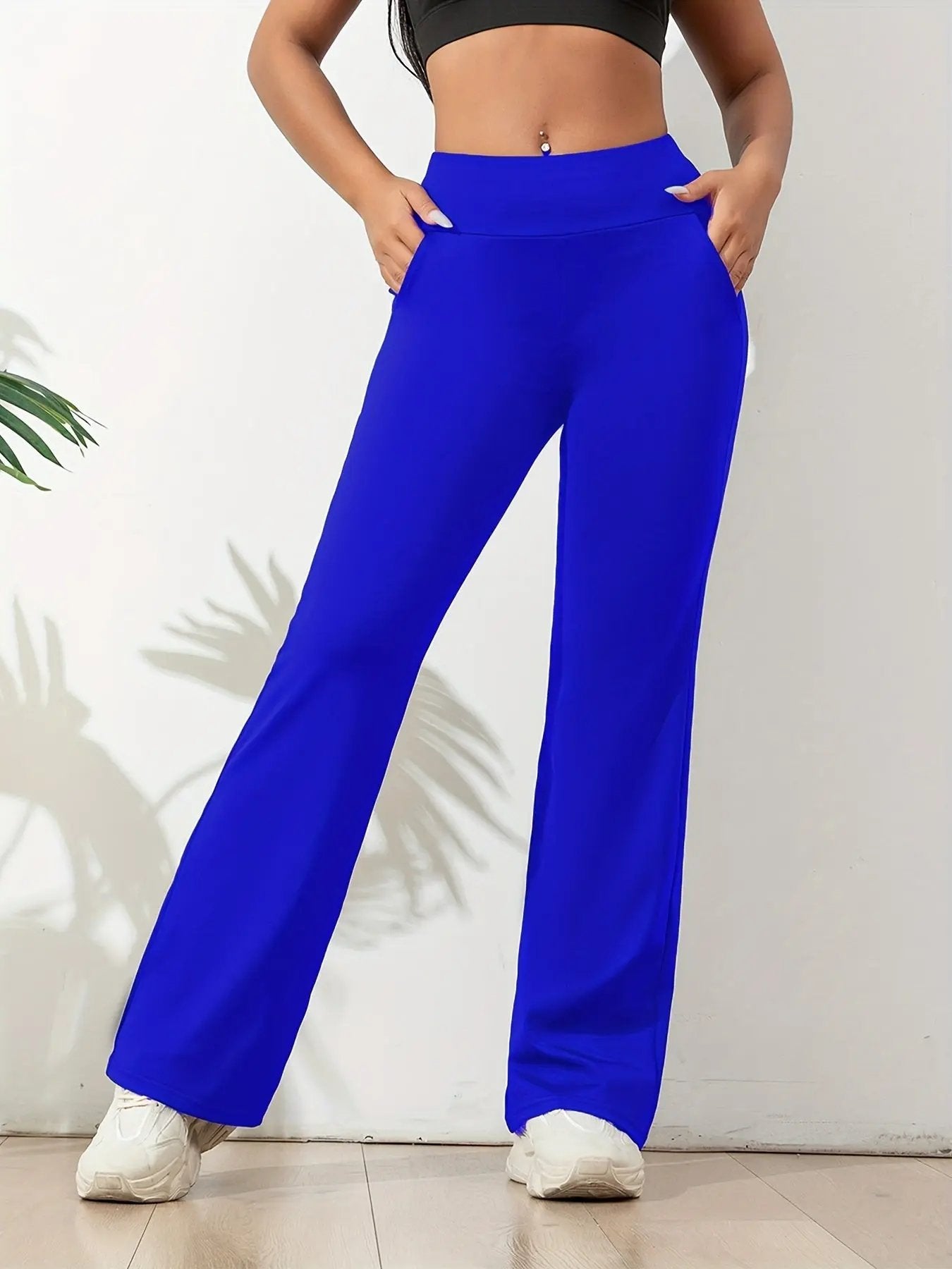 Women's high waisted yoga pants with wide waistband, four-way stretch fabric and side pockets