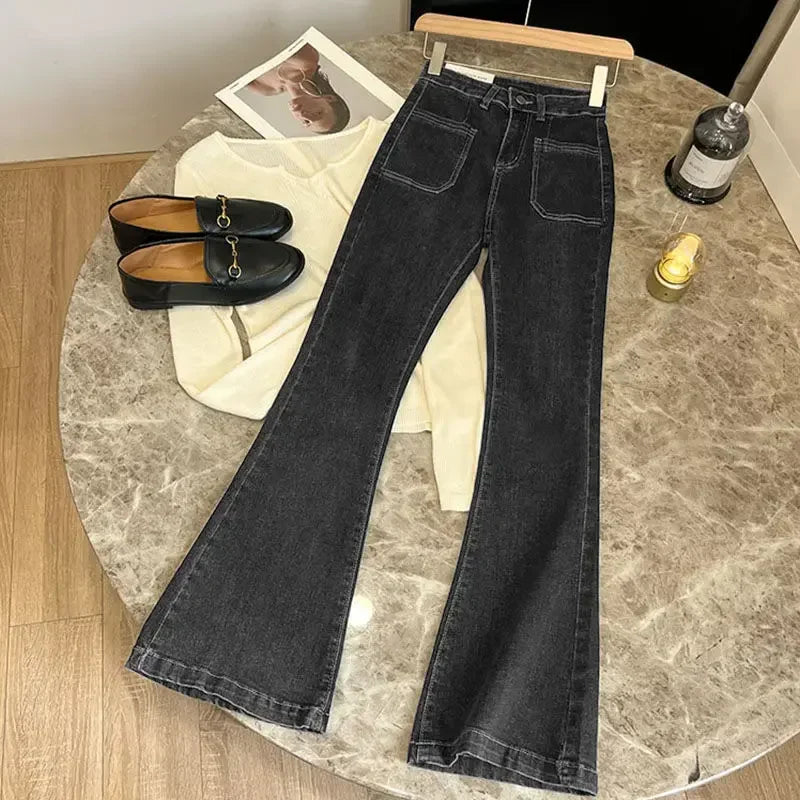 Women's high-waisted wide-leg jeans in classic blue denim with flattering waist-accentuating silhouette