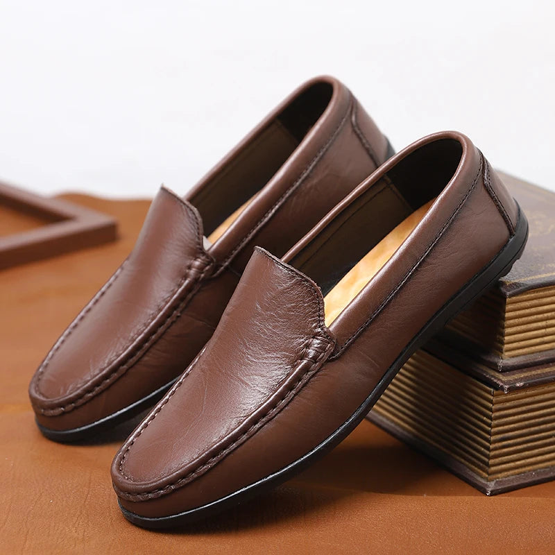 Men's genuine leather slip-on loafers in classic brown with cushioned insole and clean minimal stitching