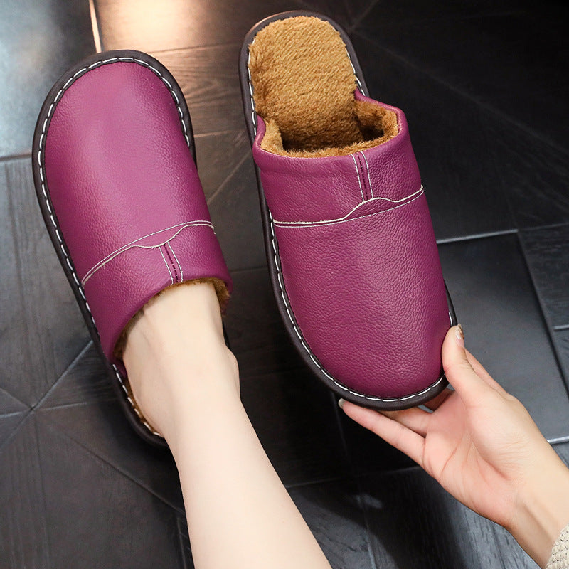 Waterproof wide-fit leather slippers in neutral tone, cozy cold-weather style with moisture-resistant upper