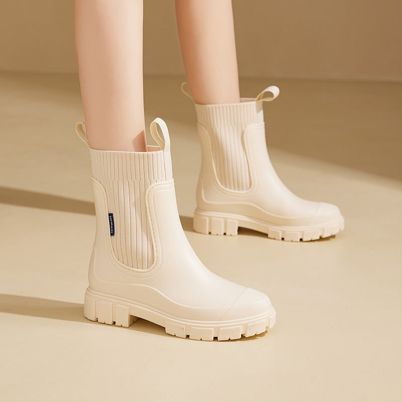 Women's black waterproof Chelsea ankle rain boots with arch support and elastic side panels