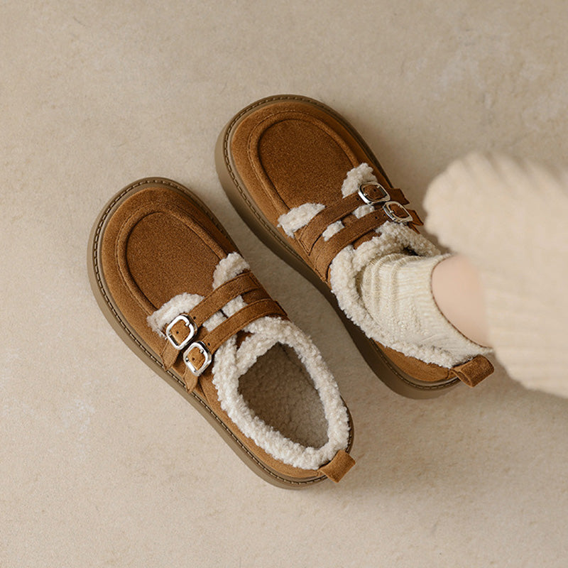 Women's black platform loafers with plush fleece lining, chunky sole, bold winter style