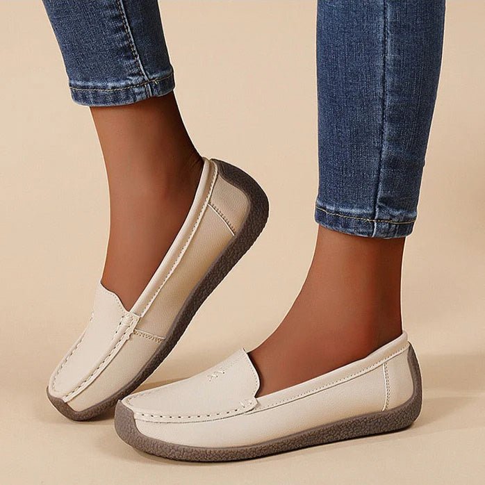 Women's wide-fit slip-on leather loafers with built-in arch support, polished professional style