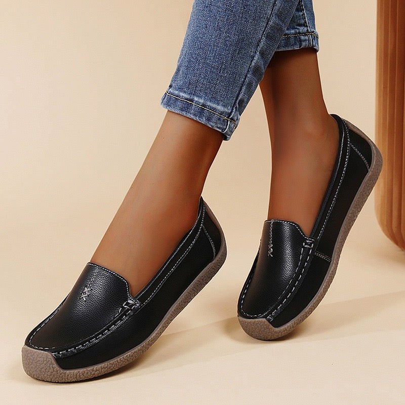 Women's wide-fit slip-on leather loafers with built-in arch support for all-day comfort